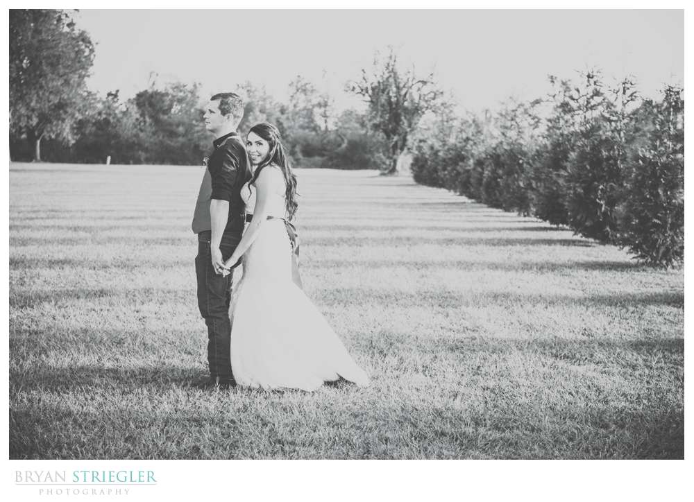 black and white portrait of bride hugging groom